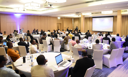 Corporate Conference with Attendees Listening to a Presentation