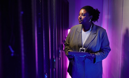 IT Professional Inspecting Data Center Servers